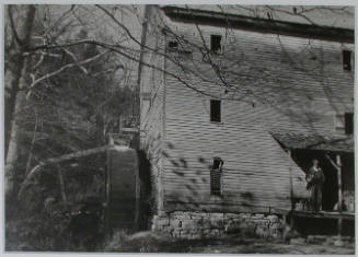 "Watermill grinding meal, run by H. L. Nicely, son of J. C. Nicely, at Goin, Tennessee. This old mill was built 100 years ago. All of this region will be deep under water when the Norris Dam reservoir fills.", 11/08/1933