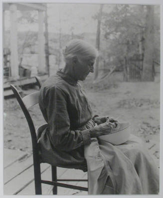 "Mrs. Sarah J. Wilson, Bulls Gap, Tennessee. The chair on which she is sitting is an example of the furniture made in the mountain region.", 10/22/1933