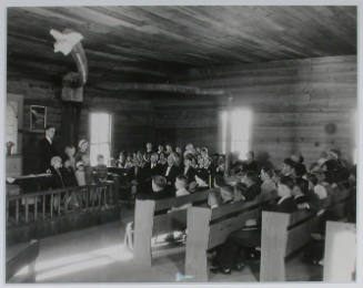 "Interior view of Sharps Station M.E. Church near Loyston, Tennessee. Reverend Lovelace and some children from an orphanage conduct the Sunday afternoon service.", 10/29/1933