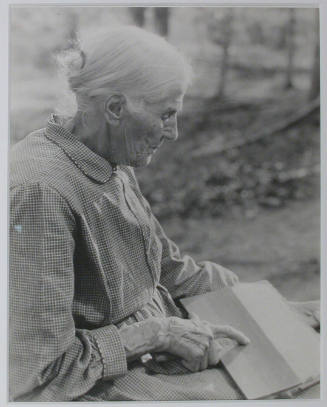"Mrs. Sarah J. Wilson, Bulls Gap, Tennessee. In addition to daily work around the home, she finds time to raise some cotton, carding and spinning it herself. She also does some hand-weaving.", 10/22/1933