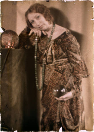 Lady in White Holding a Crystal Ball