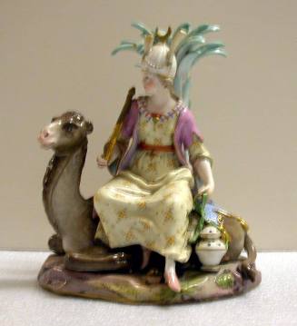 Figurine: Woman Seated on a  Reclining Camel