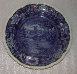 Plate: Castle Scene With Two Figures in Foreground, Floral Rim with Molded Egg and Dart Design