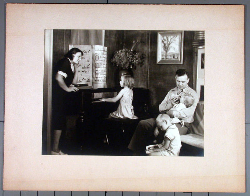 Unidentified Portrait of a Family  Around a Piano