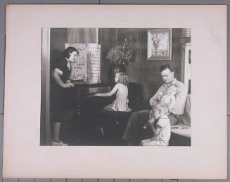 Unidentified Portrait of a Family  Around a Piano