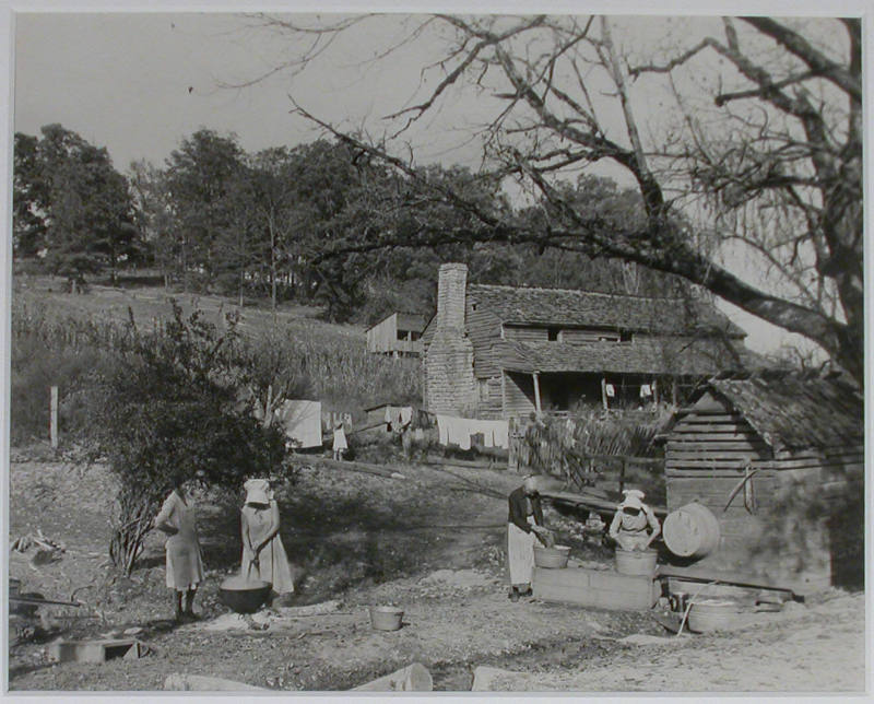 "Washday at the Stooksberry homestead near Andersonville, Tennessee. This old estate of 350 acres dates back to the Civil War. It will be submerged when the Norris Dam reservoir fills. This family is very versatile and carries on all kinds of activitie