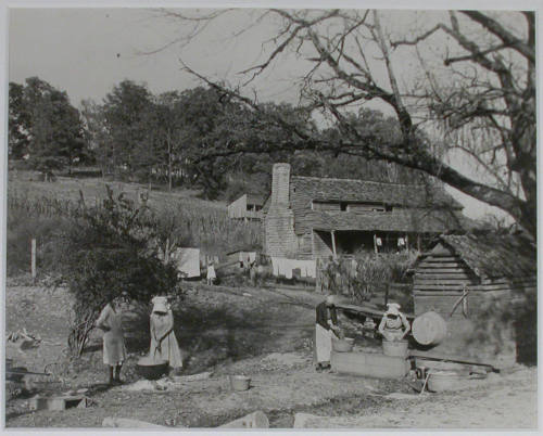 "Washday at the Stooksberry homestead near Andersonville, Tennessee. This old estate of 350 acres dates back to the Civil War. It will be submerged when the Norris Dam reservoir fills. This family is very versatile and carries on all kinds of activitie