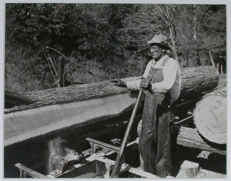 "Curtis Stiner operating circular saw at the Norris Dam site.", 10/26/1933