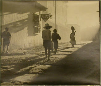 People on Street in Small Village