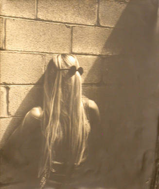 Portrait of Girl Facing Wall and Sunglasses on Back of Head