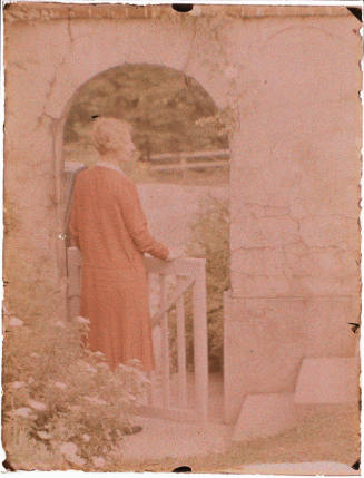 Woman in Red Dress at Gate (Laura King)