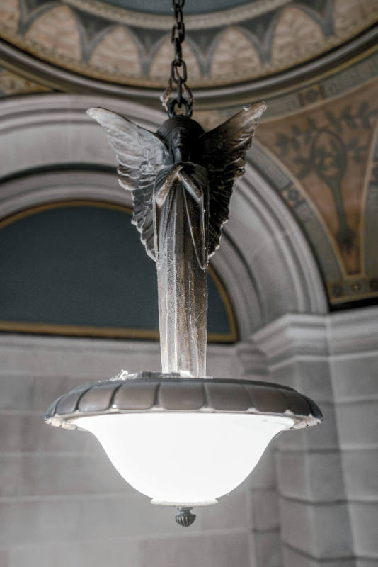 Lamp: Angel Standing atop an Oval Shaped Globe