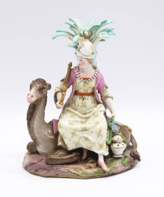 Figurine: Woman Seated on a  Reclining Camel