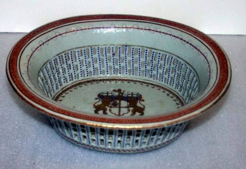 Oval Fruit Bowl with Pierced Sides and an Armorial Decoration in the Center